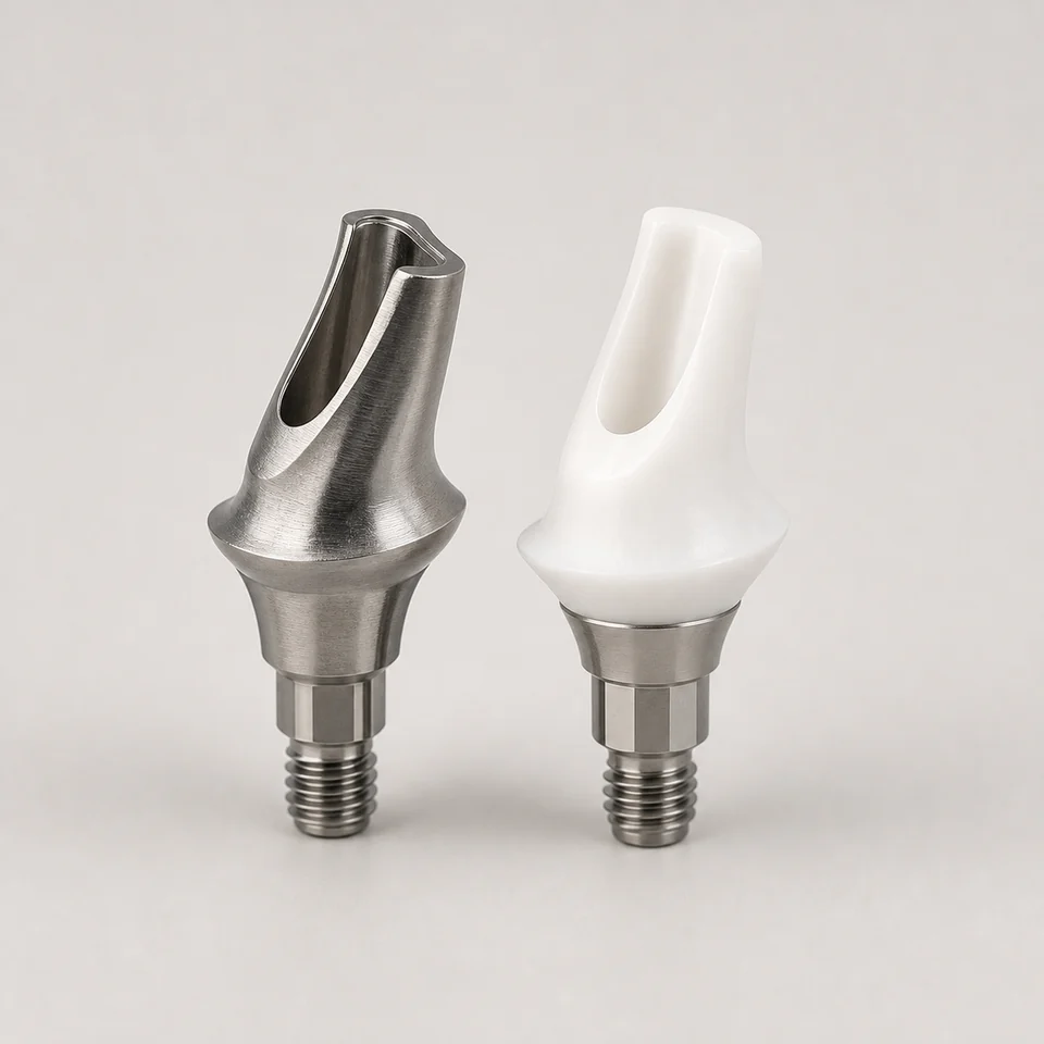 Titanium and zirconia hybrid custom implant abutments with shaped emergence profiles.